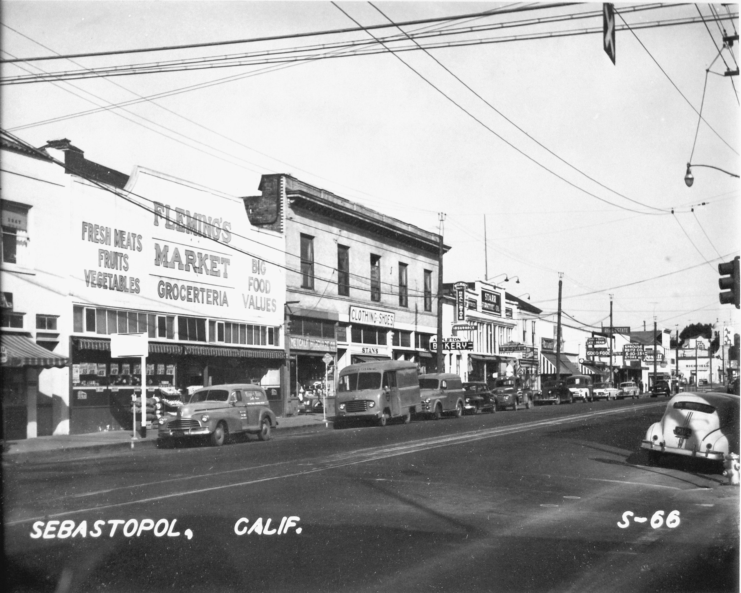 Business on North Main Street, Sebastopol circa 1940. Seen are Fleming’s Market, Metcalf Hardware, Stan’s Clothing Store, Appleton Bakery, Real Estate and Insurance office, Starr Furniture, Sprouse Reitz, and Rexall Drug Store.