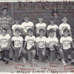 Minor League Baseball Champions 1957 team photo. 1957 was the first year of Little League in Sebastopol and was sponsored by Bill Guanelle. Photo was taken at Ives Park with the old wooden bleachers in the background and chicken wire backstop. All the players are wearing Sebastopol Little League Clubs t-shirts and caps. (Note the misspelling of “Sebastopol” on the t-shirts.) Hand written in red on the photo are all the signed names of the players and the following: “We, The Cubs, are proud and honored to have you, Bill Guanelle, for our sponsor and your interest in the betterment of the youth of Sebastopol.” Pictured are: back row L-R: Coach Roy Camozzi, George Sheridan, Pete Hill, Richard Fye, Duane Kitchens and Charles Symes. Front row: L-R Stevie Fiori, Jerry Breuggmann, Stevie Powell, Donald Graham, Randy Hankins and Jimmy Breuggmann.