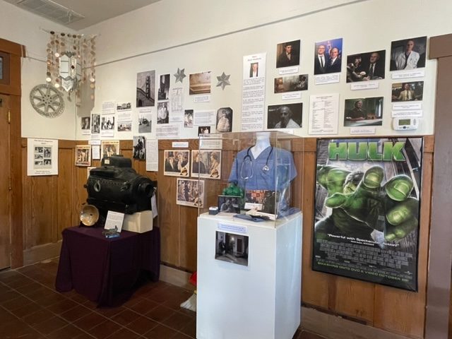 The El Rey theater history and a vintage film projector and Mark Atteberrys career on display.